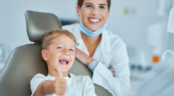 Dentist and satisfied patient smiling post-treatment at Friedman Dental Group in Fort Lauderdale.