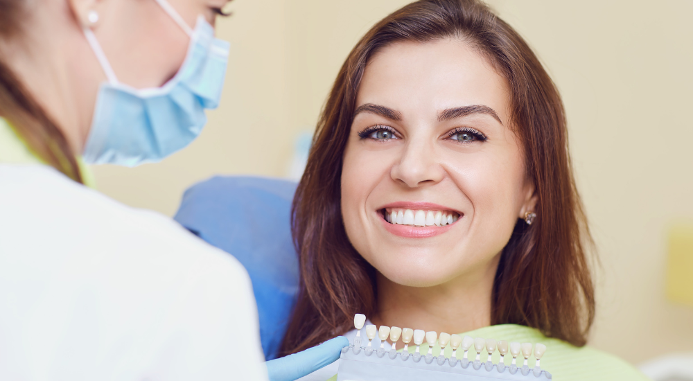 Dentist and content patient post-dental crown placement at Friedman Dental Group, a trusted provider for Dental Crowns in Miami.