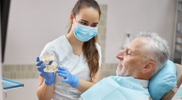 Dentist and elated patient post-treatment at Friedman Dental Group Coral Springs location near Parkland FL.