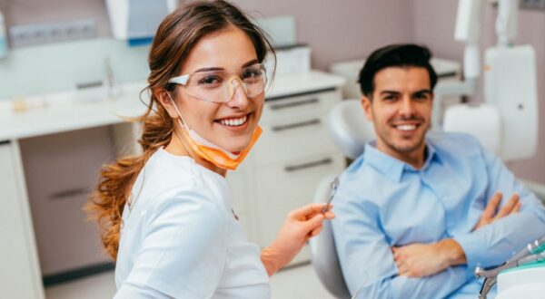 Dentist and satisfied patient post-dental implant placement at Friedman Dental Group, a trusted provider for Dental Implants in Fort Lauderdale.